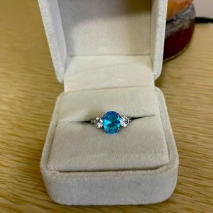 Size 5 silver ring with blue and white stones